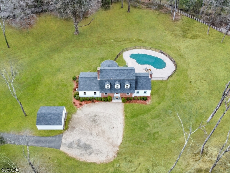 72 Youngs Road Basking Ridge, NJ 07920 - Photo 3 of 31 a swimming pool with some tall trees