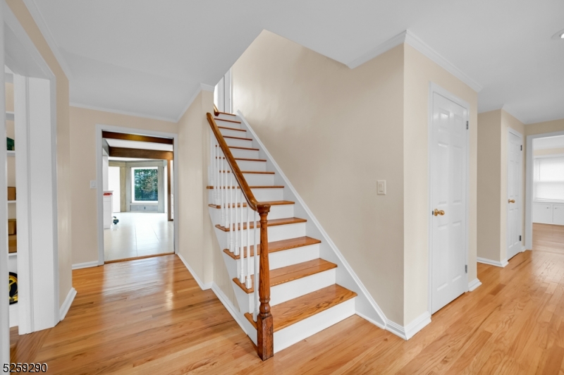 72 Youngs Road Basking Ridge, NJ 07920 - Photo 9 of 31 a view of a hallway with wooden floor and staircase