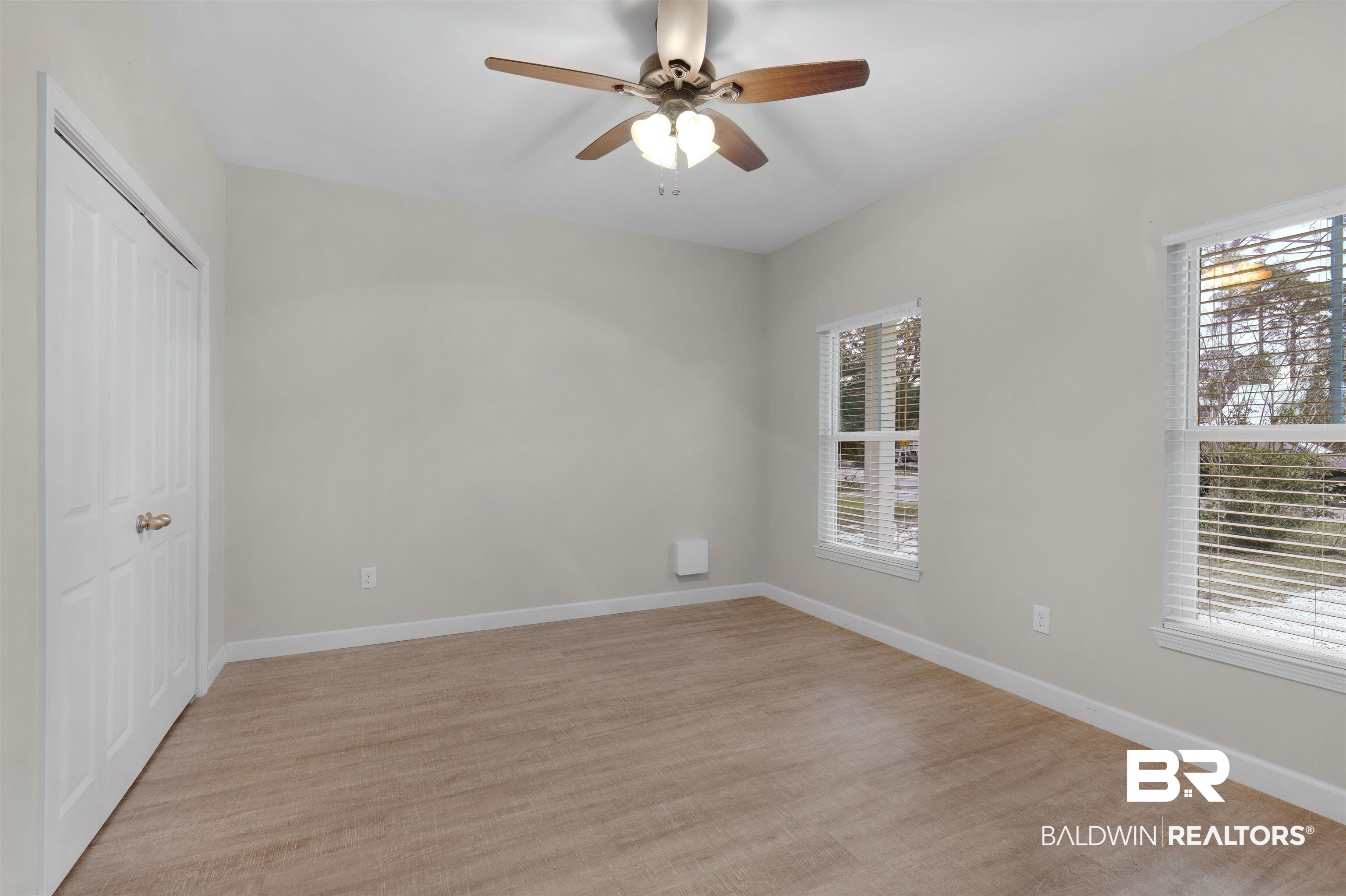 5625 Georgia Street Orange Beach, AL 36561 - Photo 17 of 30 Unfurnished room featuring light wood-type flooring and ceiling fan