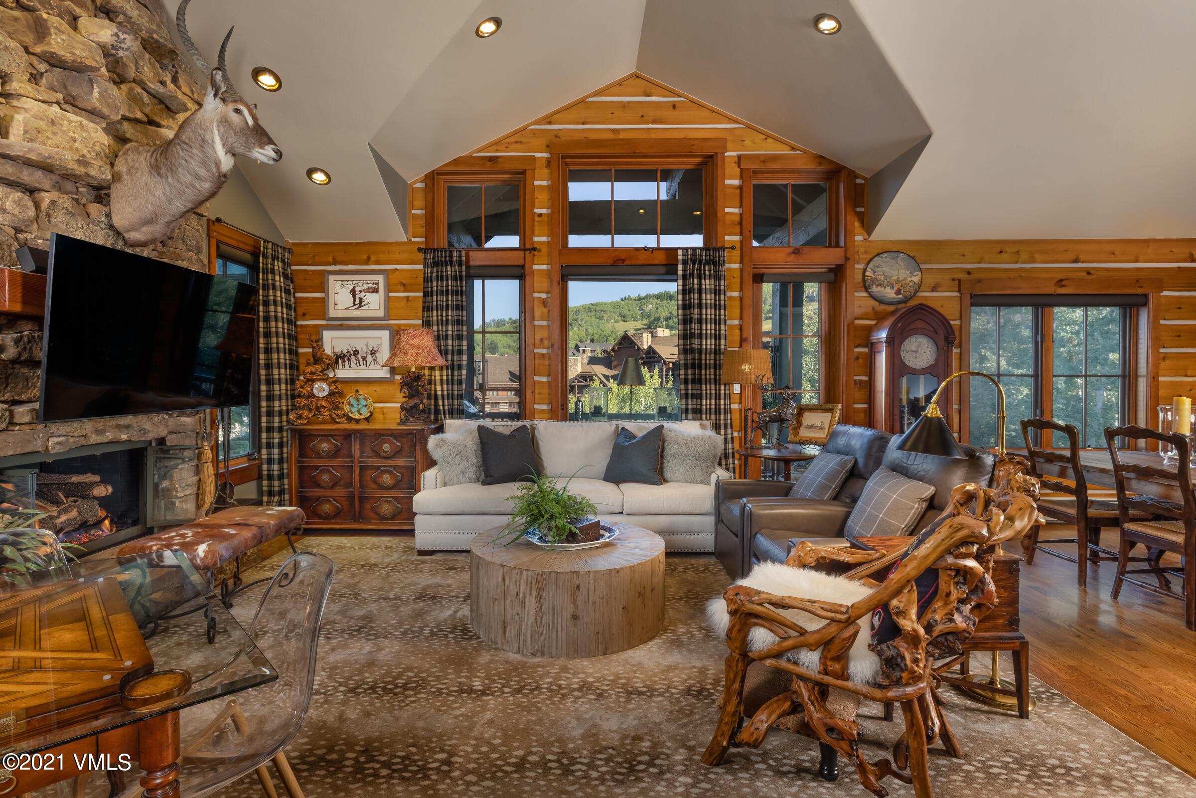 a living room with patio furniture and a flat screen tv