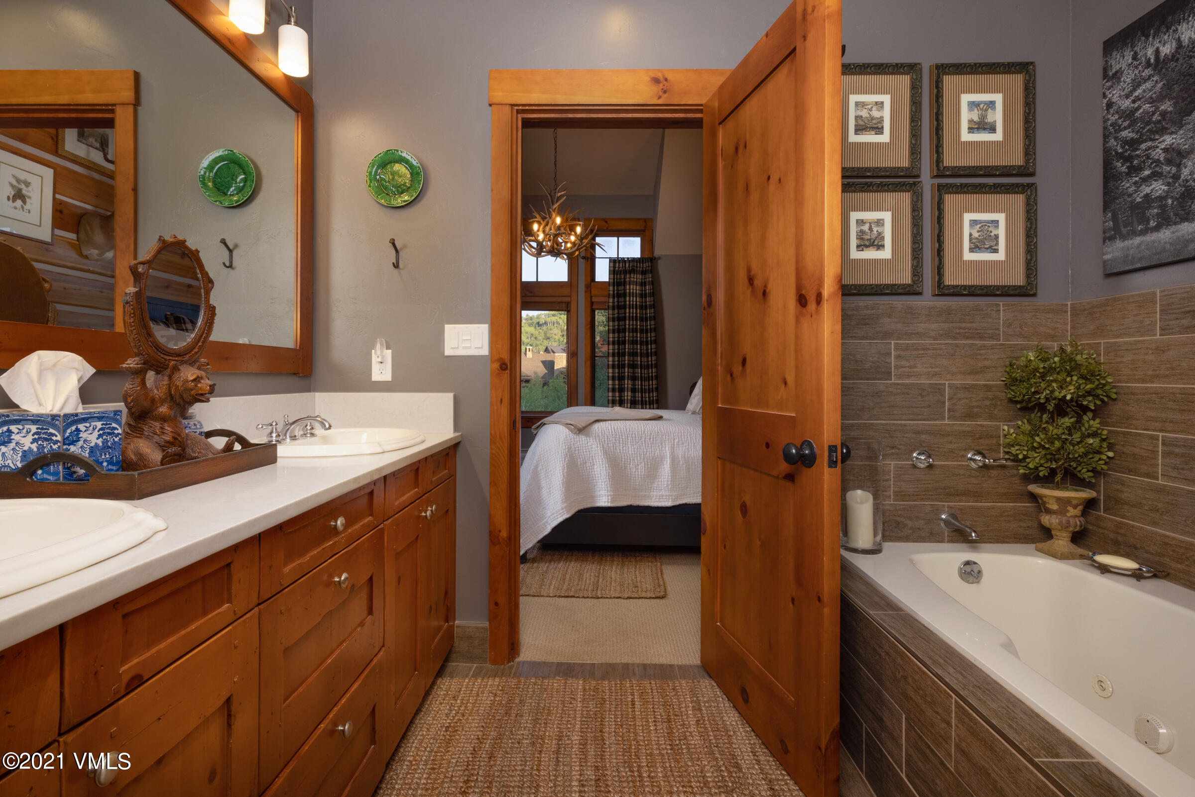 264 Bachelor Ridge Road Avon, CO 81620 - Photo 11 of 21 a en suite bathroom with a double vanity sink a mirror and shower