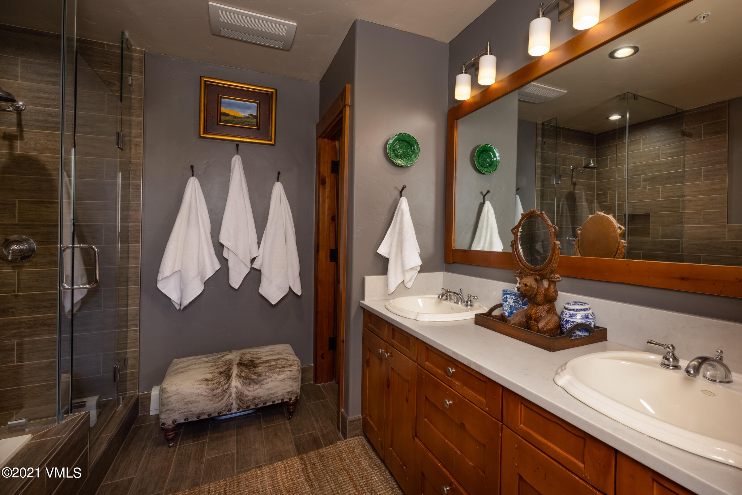 264 Bachelor Ridge Road Avon, CO 81620 - Photo 12 of 21 a bathroom with a double vanity sink and a mirror