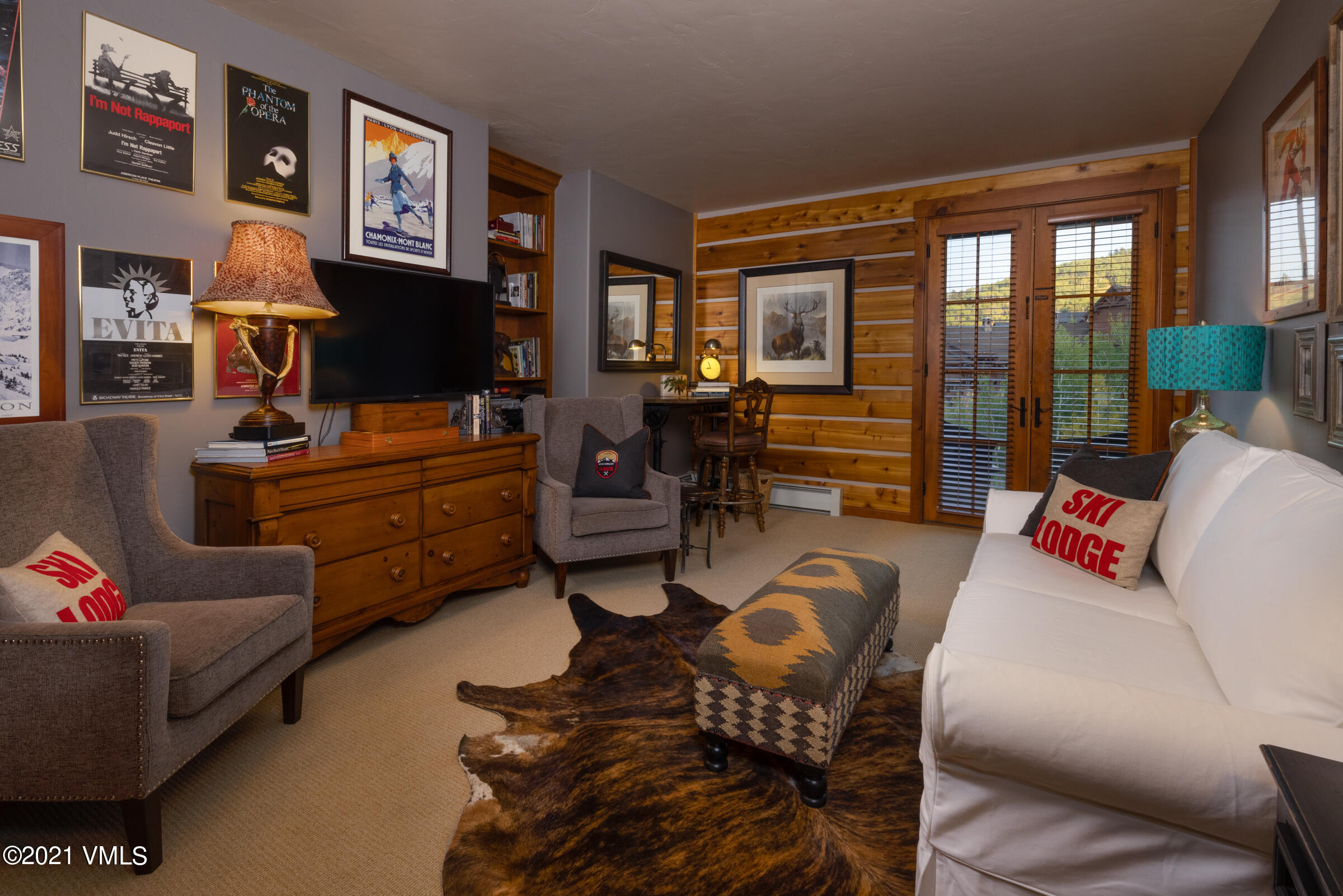 264 Bachelor Ridge Road Avon, CO 81620 - Photo 13 of 21 a living room with furniture and a flat screen tv