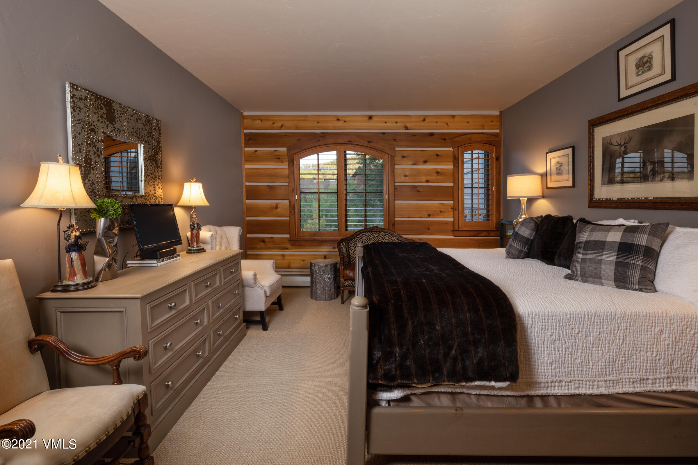 264 Bachelor Ridge Road Avon, CO 81620 - Photo 15 of 21 a large bedroom with a bed and wooden floor