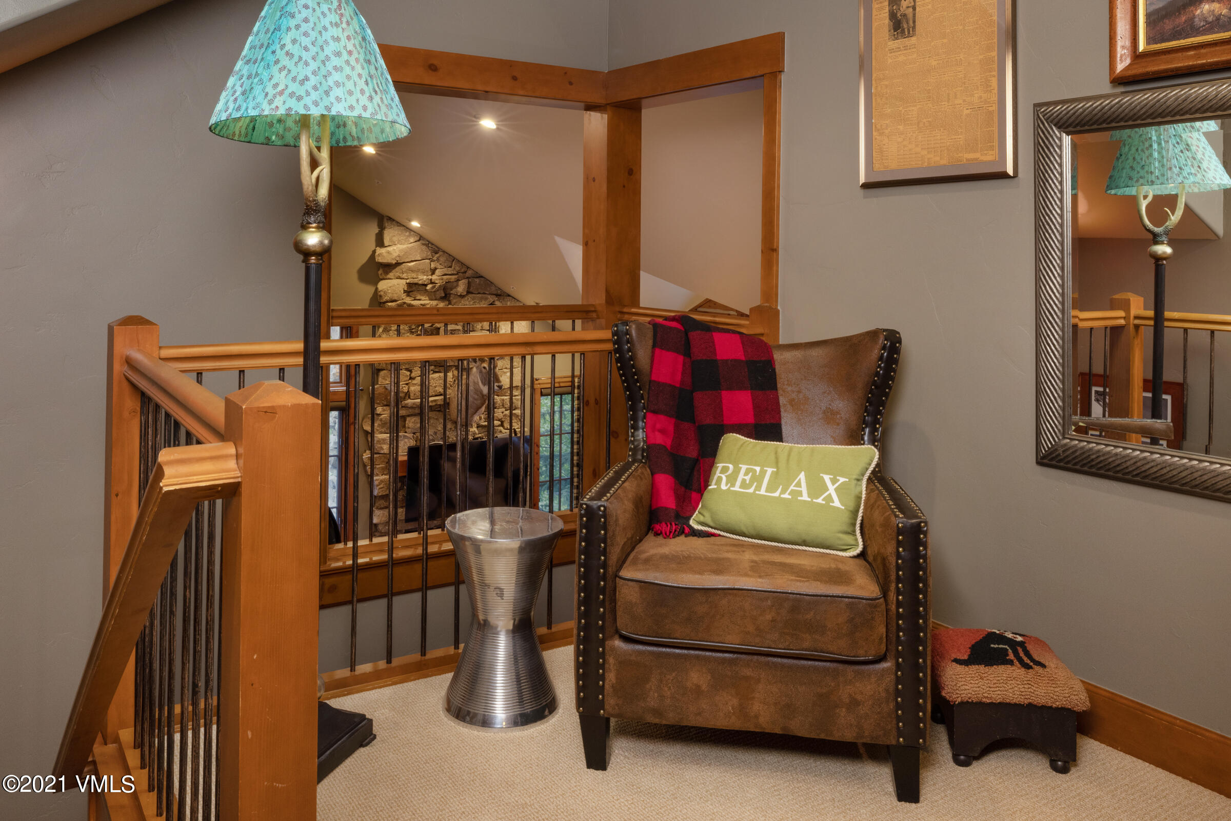 264 Bachelor Ridge Road Avon, CO 81620 - Photo 16 of 21 a bedroom with a bed and a chandelier