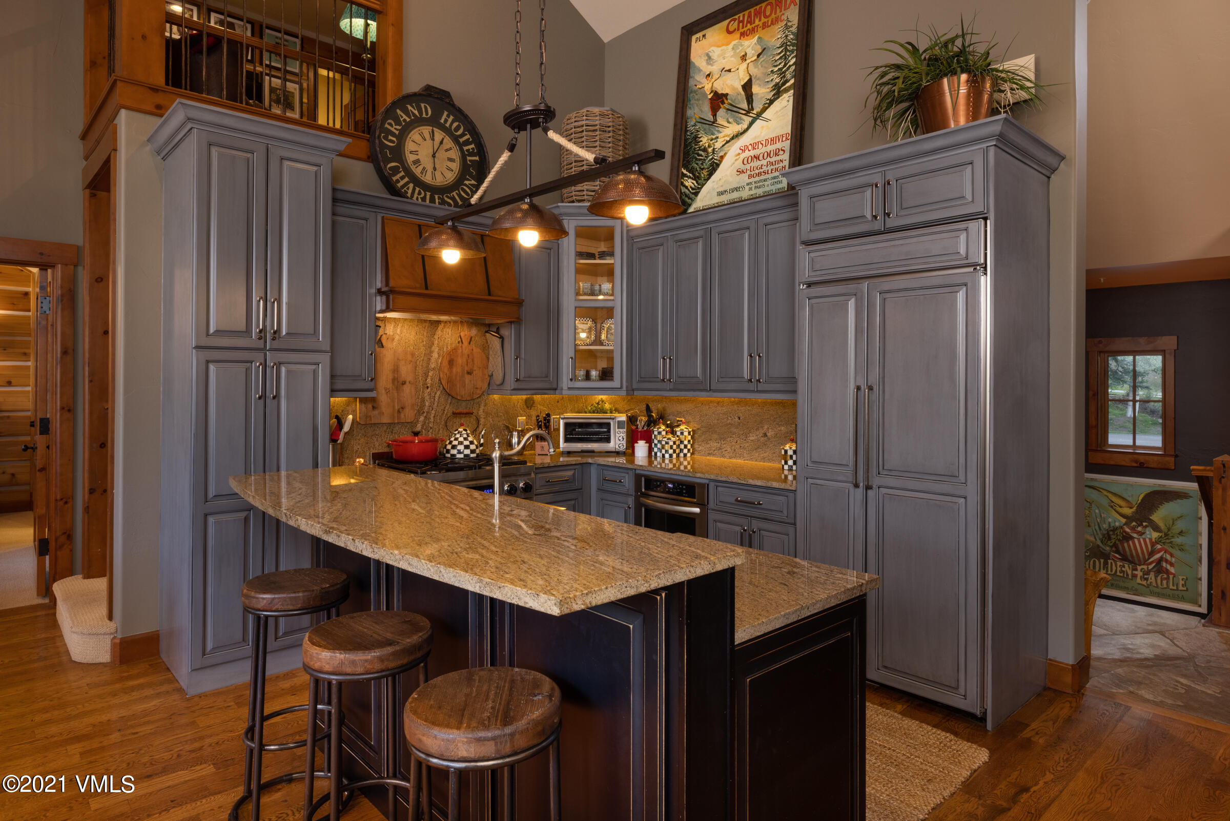 264 Bachelor Ridge Road Avon, CO 81620 - Photo 6 of 21 a kitchen with a table chairs and refrigerator