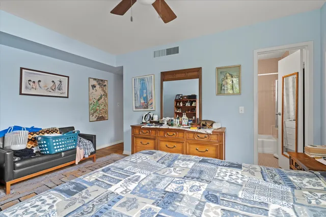 a bed room with a bed and a television