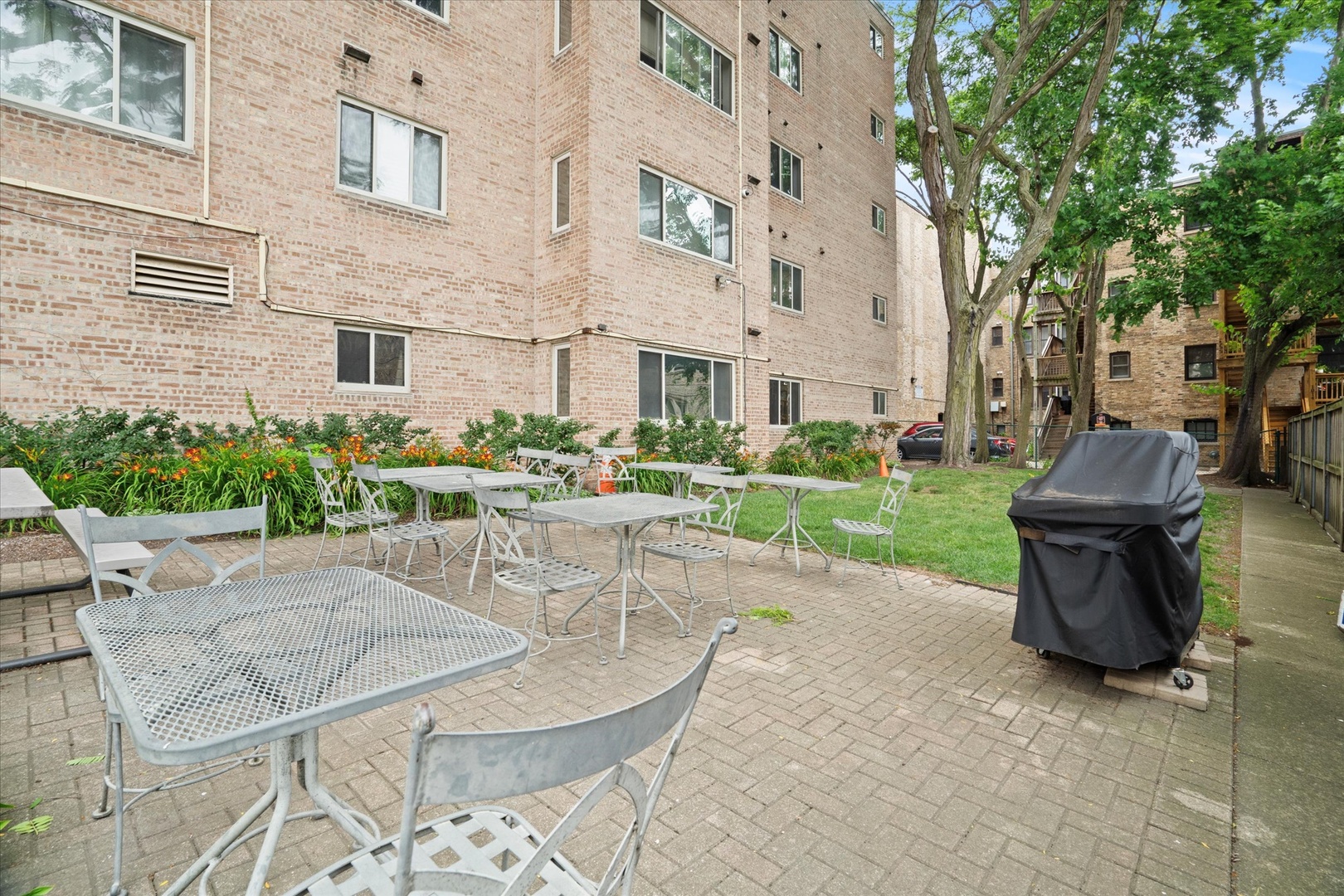 835 Ridge Avenue, Unit 507 Evanston, IL 60202 - Photo 22 of 23 a view of a patio with couches table and chairs and potted plants