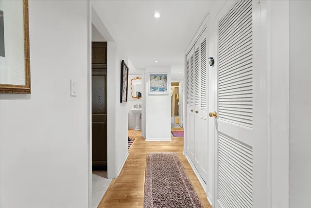 a view of a hallway with white walls