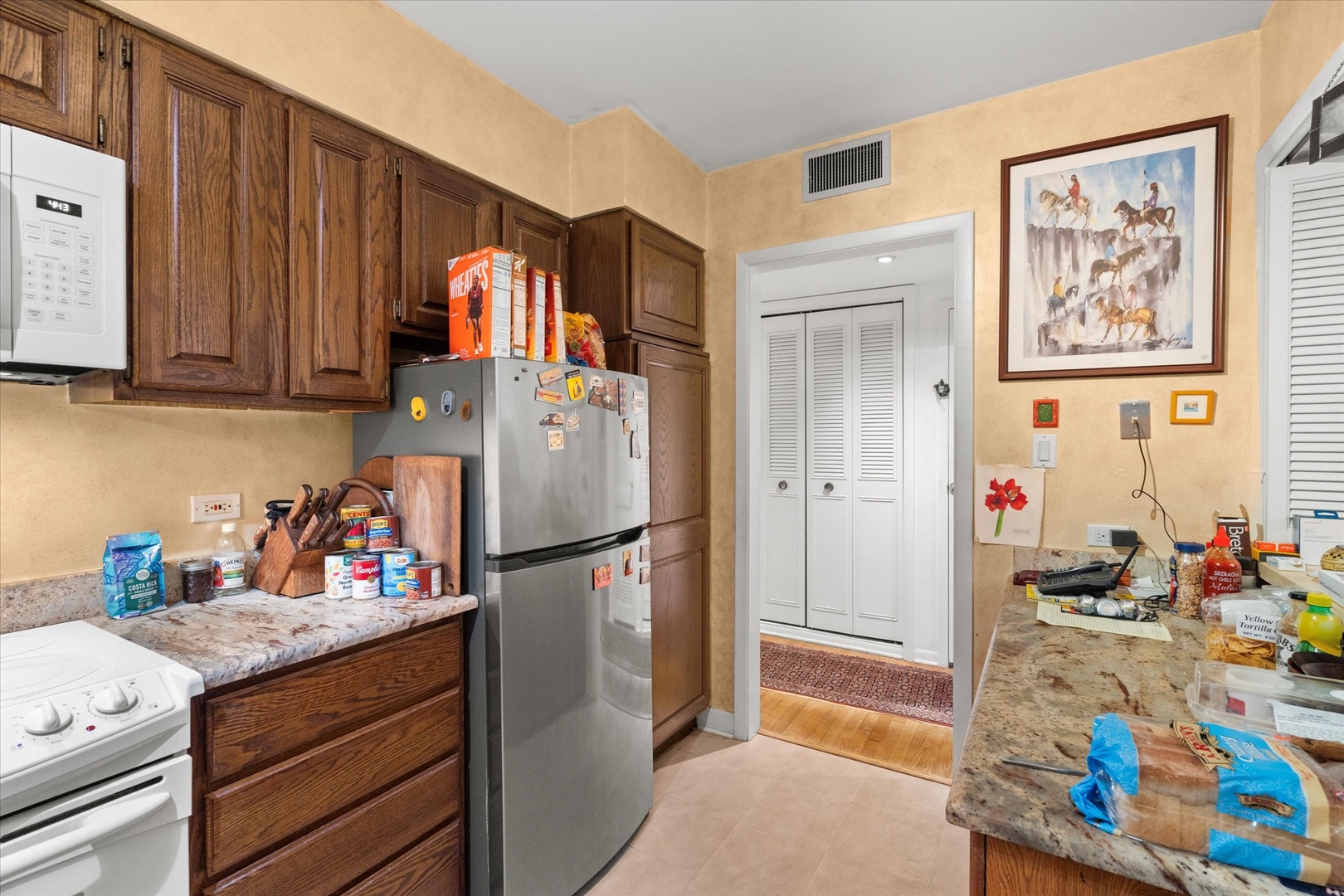 835 Ridge Avenue, Unit 507 Evanston, IL 60202 - Photo 7 of 23 a kitchen with refrigerator and cabinets
