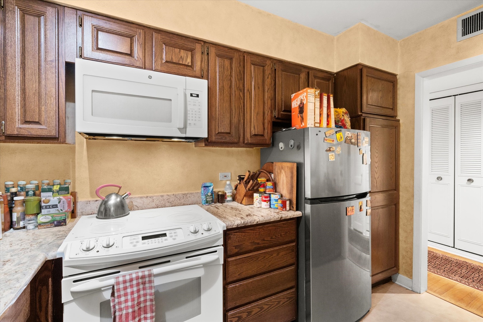 835 Ridge Avenue, Unit 507 Evanston, IL 60202 - Photo 9 of 23 a kitchen with stainless steel appliances granite countertop a refrigerator sink and cabinets
