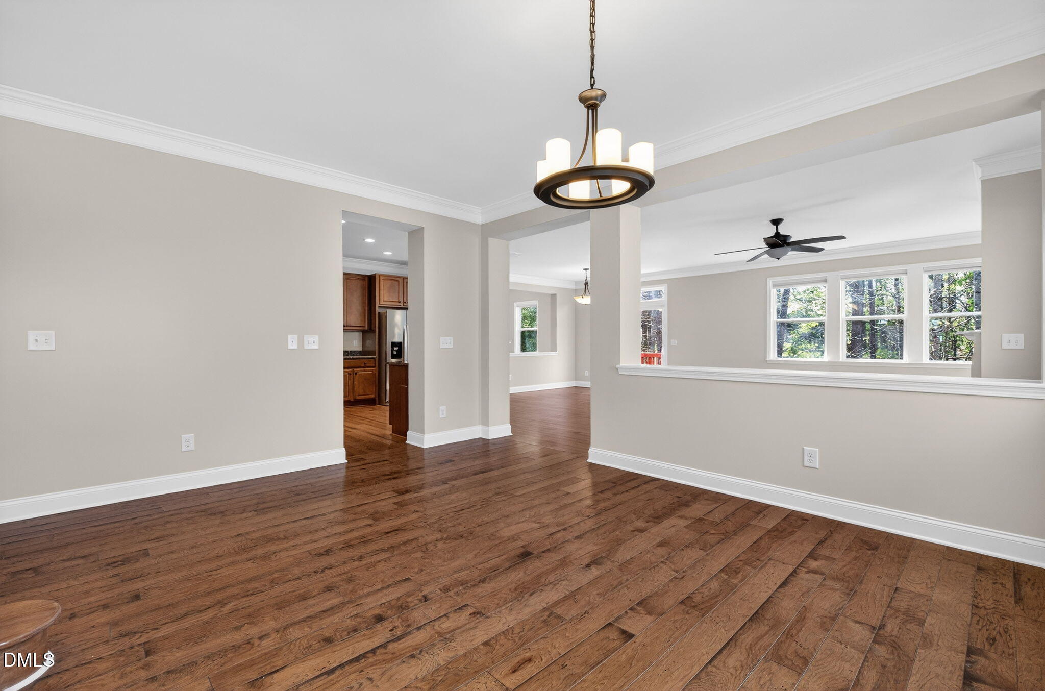 1304 Barnford Mill Road Wake Forest, NC 27587 - Photo 9 of 44 a view of an empty room with wooden floor and a window