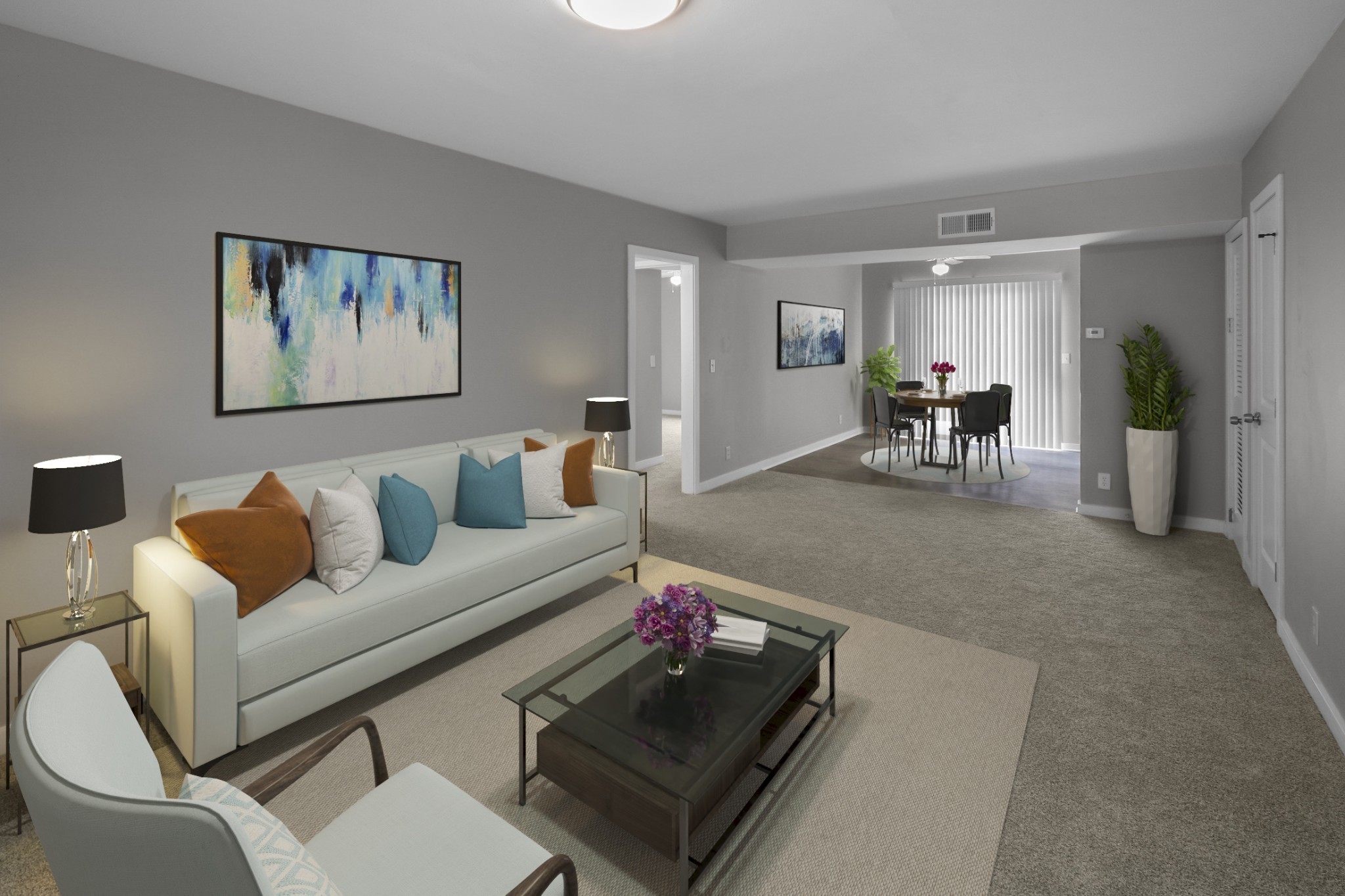 a living room with furniture and wooden floor