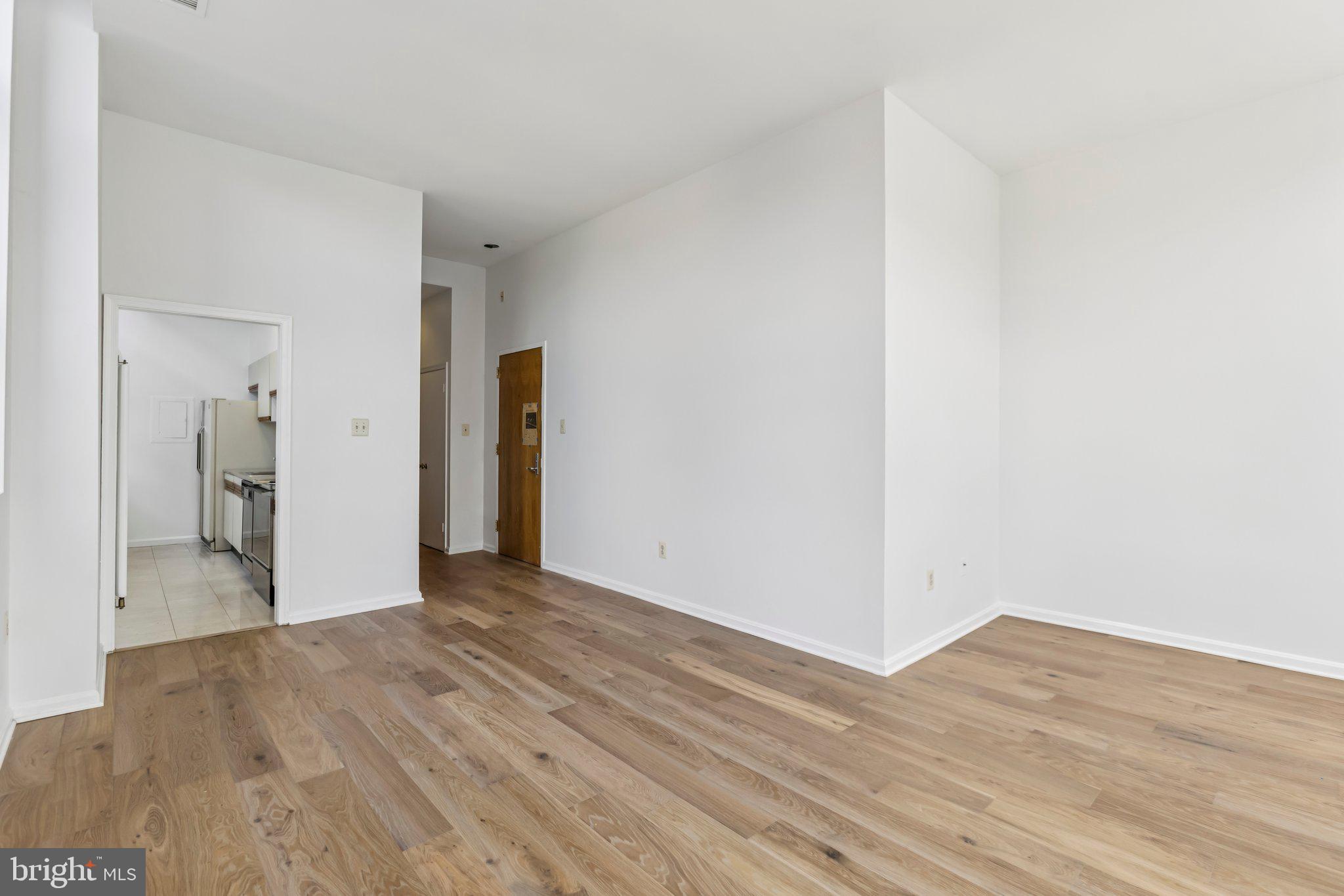 3299 K Street Northwest, Unit 304 Washington, DC 20007 - Photo 11 of 31 a view of empty room with wooden floor