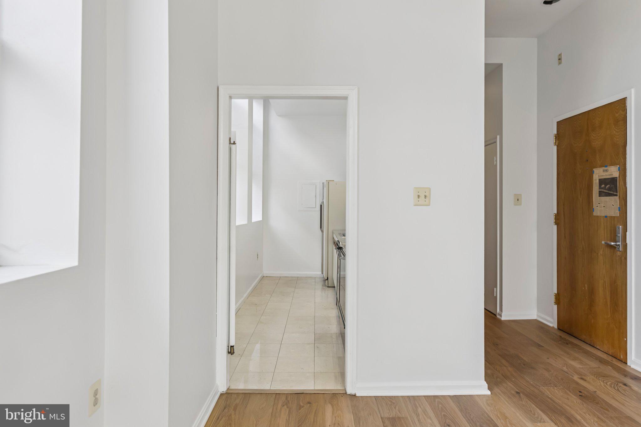 3299 K Street Northwest, Unit 304 Washington, DC 20007 - Photo 12 of 31 a view of a hallway with wooden floor