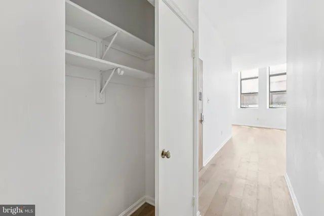 a view of a room with white walls