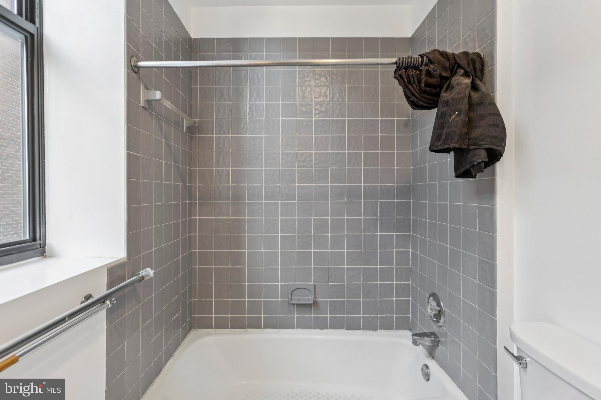 3299 K Street Northwest, Unit 304 Washington, DC 20007 - Photo 22 of 31 a bathroom with a bathtub