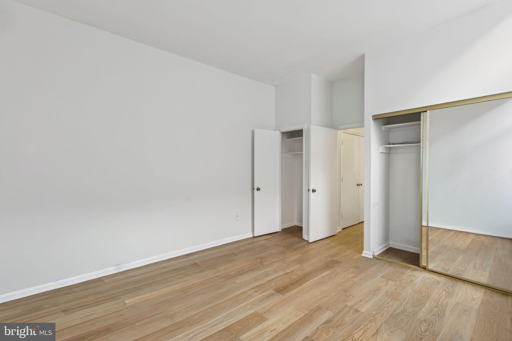 3299 K Street Northwest, Unit 304 Washington, DC 20007 - Photo 25 of 31 wooden floor in an empty room