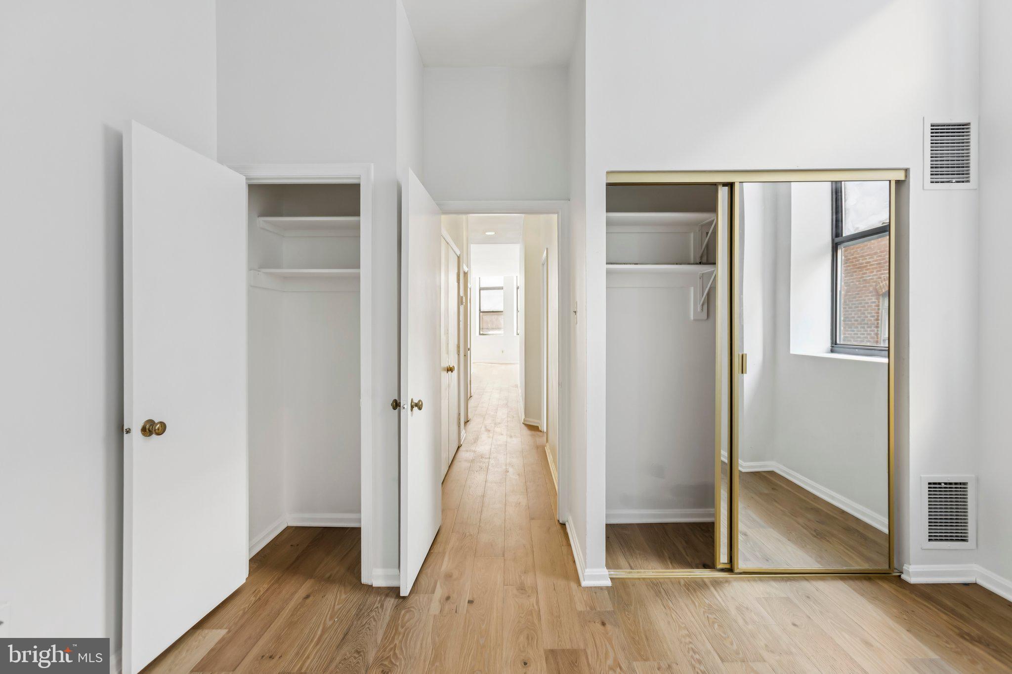 3299 K Street Northwest, Unit 304 Washington, DC 20007 - Photo 26 of 31 a view of a hallway with wooden floor and entryway