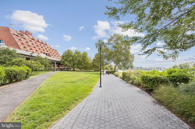 a view of a pathway with a yard