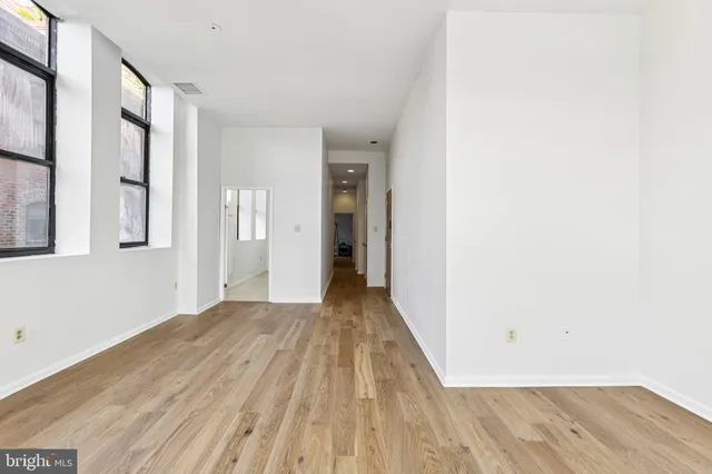 a view of a room with wooden floor and stairs