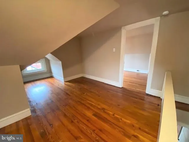 a view of a living room with wooden floor