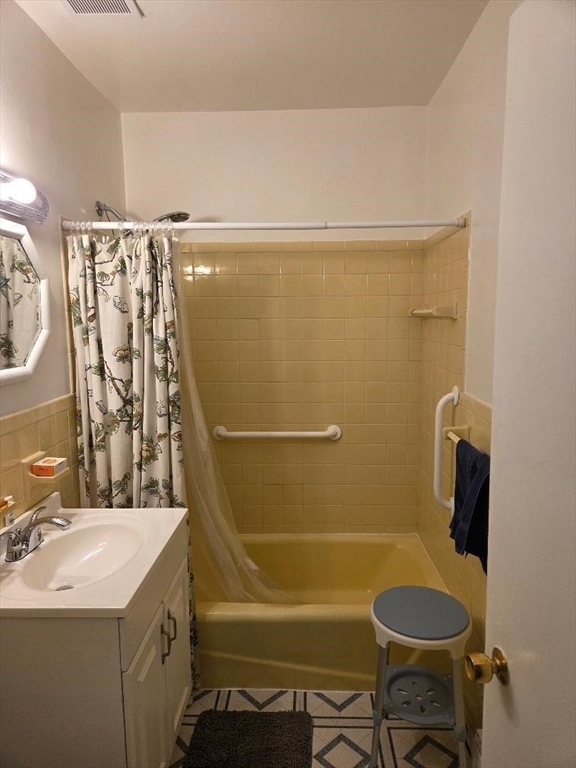 111 Grove Boston Ma, Unit 6 Boston, MA 02132 - Photo 11 of 14 a bathroom with a sink a toilet and shower
