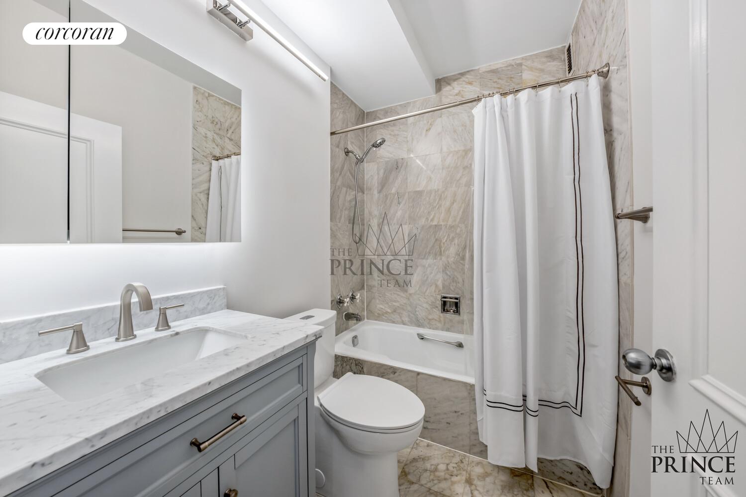 380 Rector Place, Unit 10F Manhattan, NY 10280 - Photo 5 of 14 a bathroom with a granite countertop sink toilet and shower