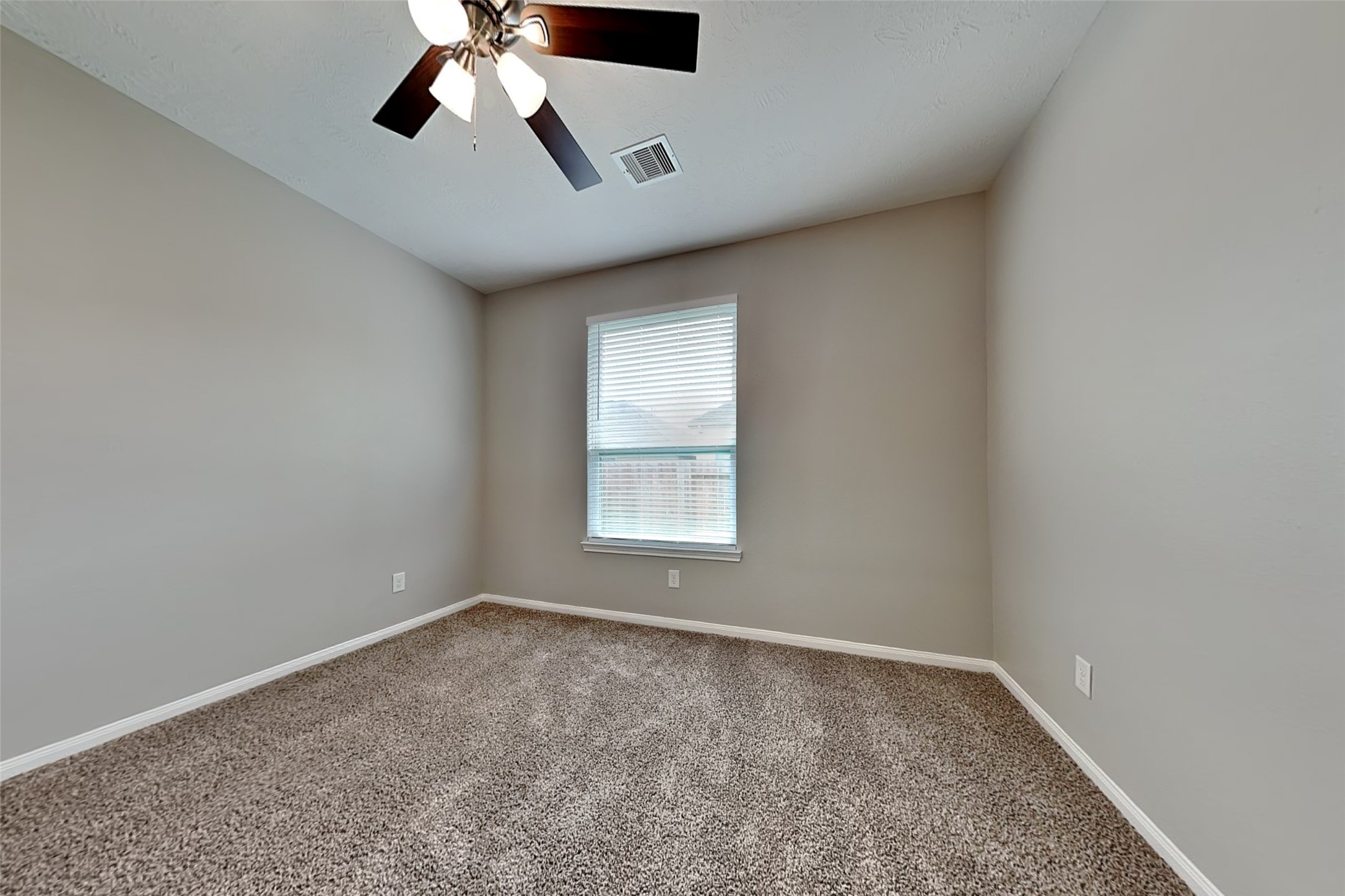 30710 Basil Trace Drive Spring, TX 77386 - Photo 12 of 18 an empty room with a window and a fan