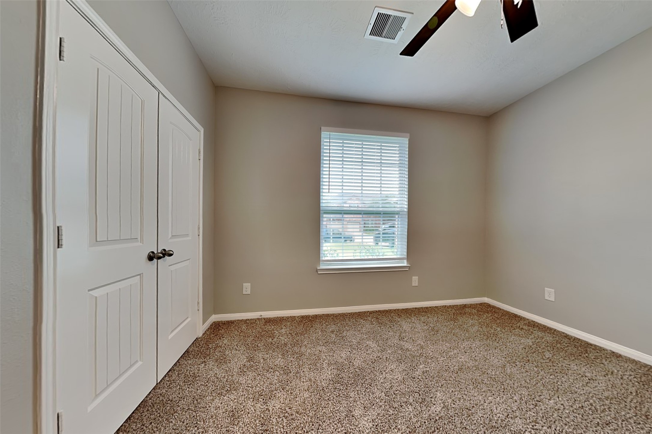 30710 Basil Trace Drive Spring, TX 77386 - Photo 15 of 18 an empty room with ceiling fan and windows
