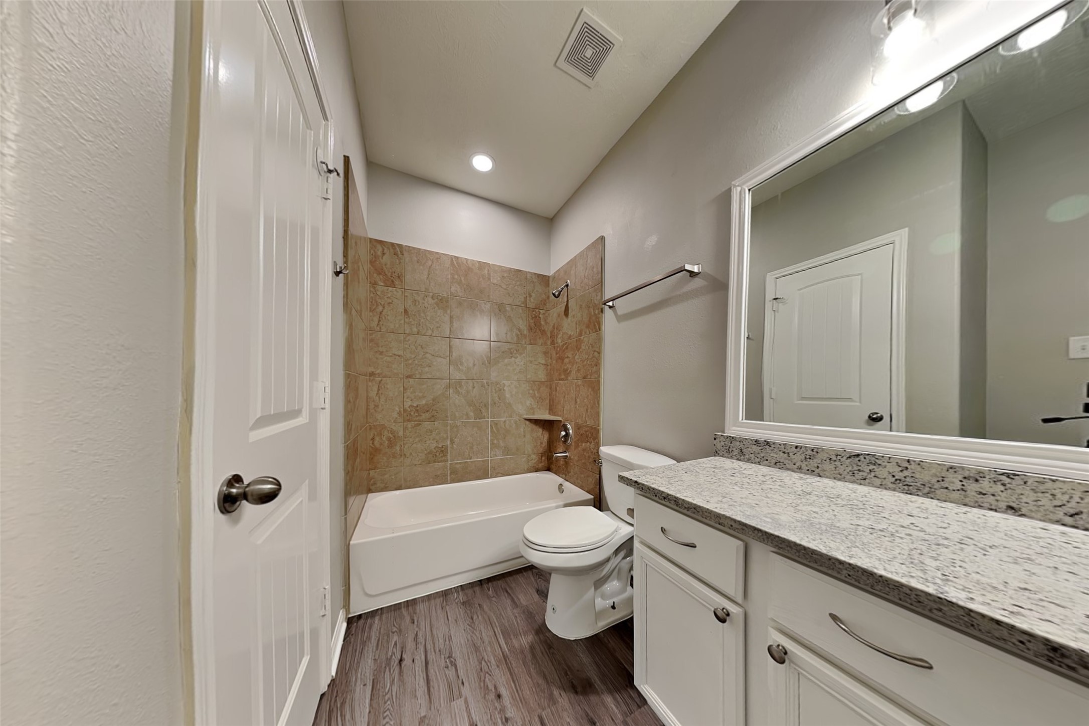 30710 Basil Trace Drive Spring, TX 77386 - Photo 16 of 18 a bathroom with a granite countertop sink a toilet and shower