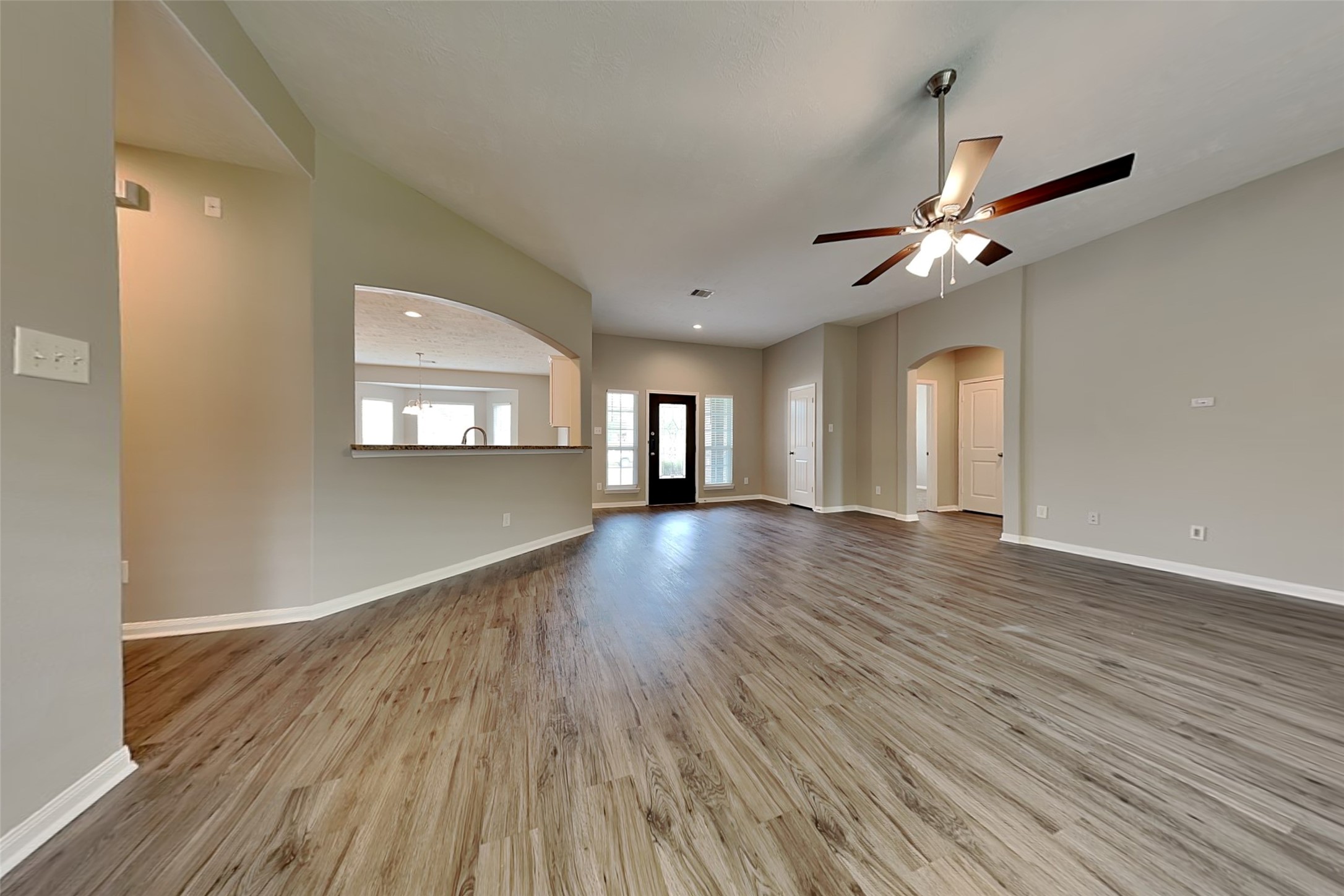30710 Basil Trace Drive Spring, TX 77386 - Photo 2 of 18 a view of an empty room with wooden floor and a window