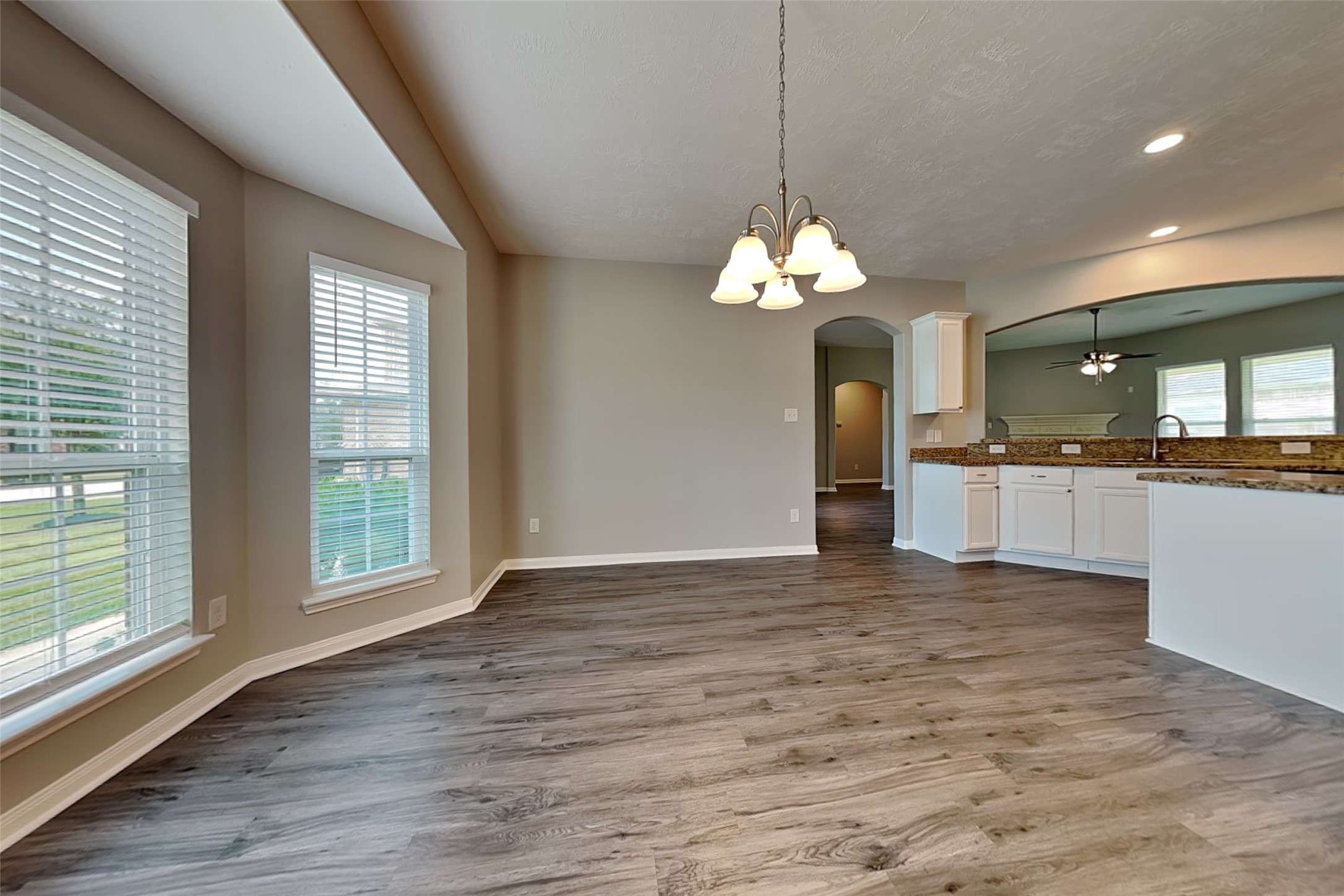 30710 Basil Trace Drive Spring, TX 77386 - Photo 7 of 18 a view of a kitchen with granite countertop cabinets and a table