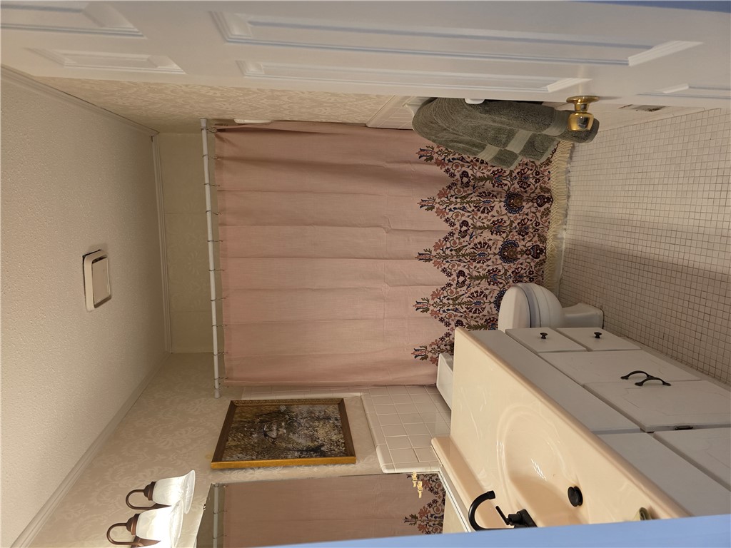 500 Concord Road, Unit C3 Anderson, SC 29621 - Photo 5 of 17 This bathroom features elegant tiling and a classic vanity, offering a clean and functional design.