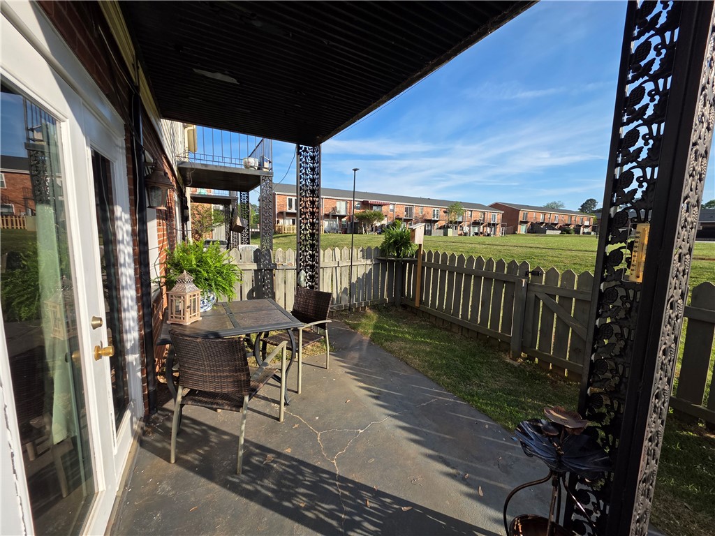 500 Concord Road, Unit C3 Anderson, SC 29621 - Photo 10 of 17 Enjoy outdoor living on this charming patio, offering partial shade from balcony above.