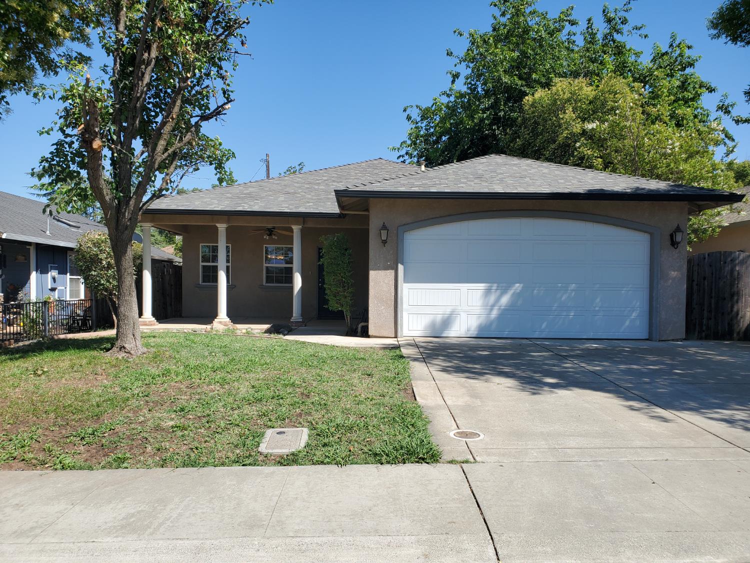 a front view of a house with a yard