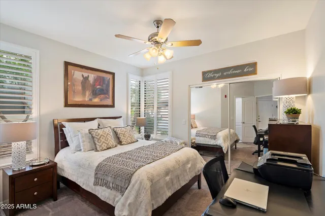 a bedroom with a bed and a couch