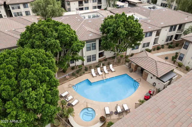 an aerial view of a house with outdoor space