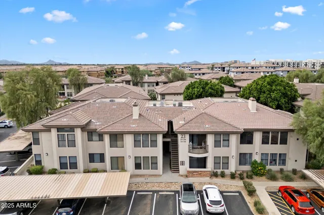 a aerial view of a large white building under an umbrella