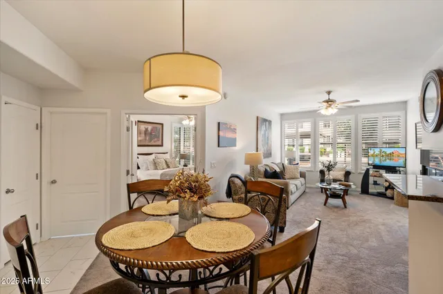 a living room with dining table