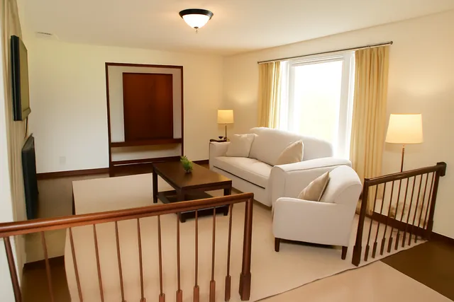 a view of an entryway with wooden floor