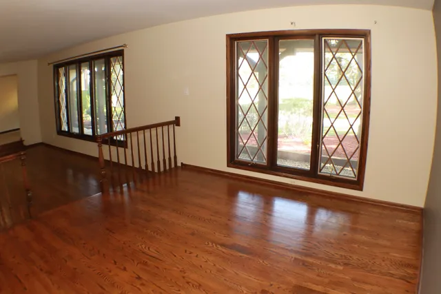 a view of a dining room with furniture and window