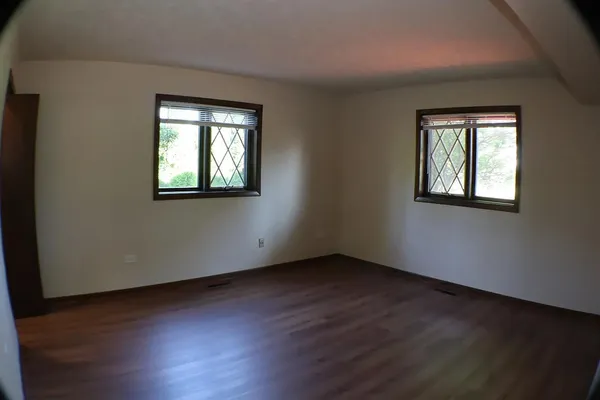 a room with window and pool table