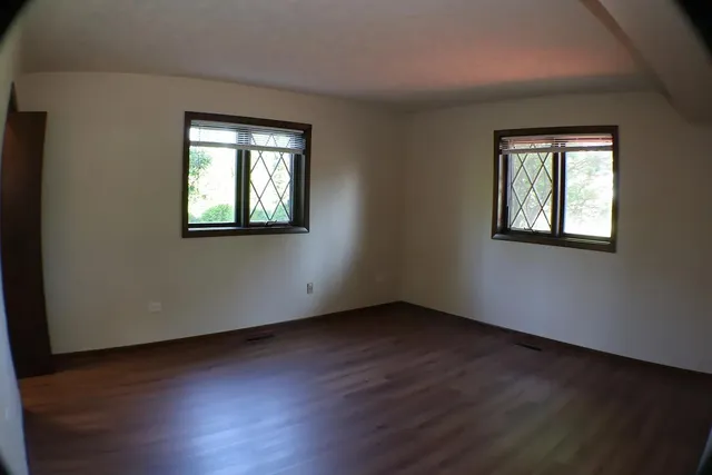 a room with window and pool table