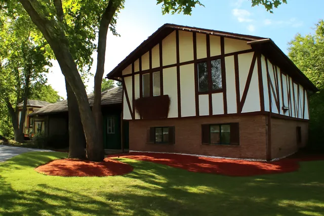 swimming pool view with a garden