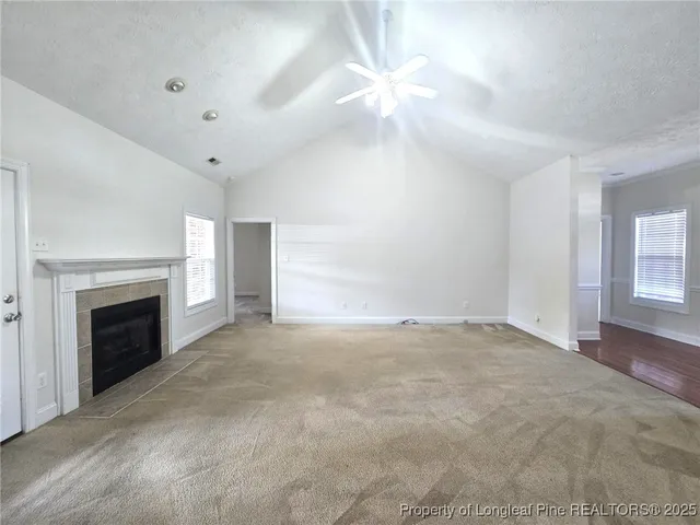 a view of empty room with fireplace