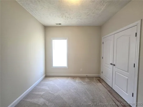 a view of a room that has a window in it