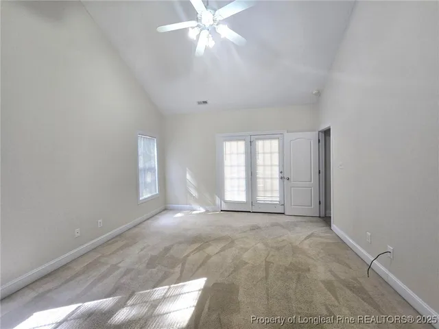 a bathroom with a bathtub sink and mirror