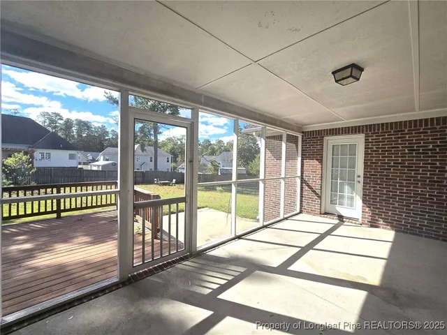 a view of wooden deck with a bench