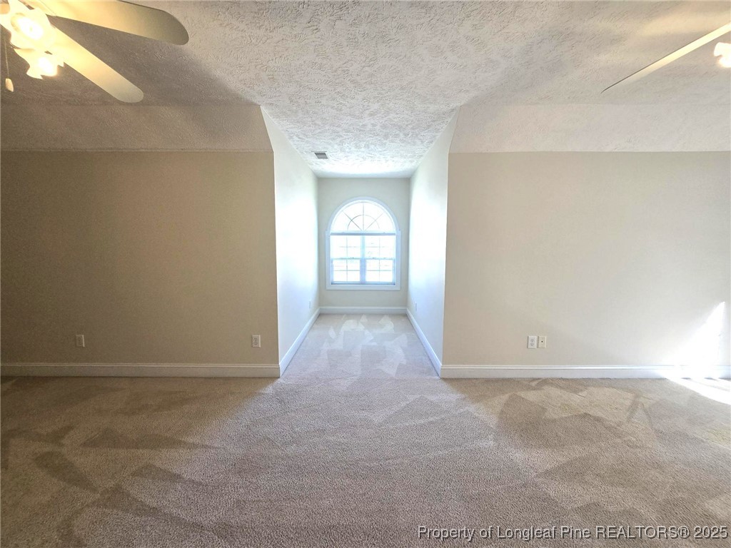 3941 Birkhoff Lane Fayetteville, NC 28304 - Photo 40 of 41 a view of a hallway with wooden floor and a window